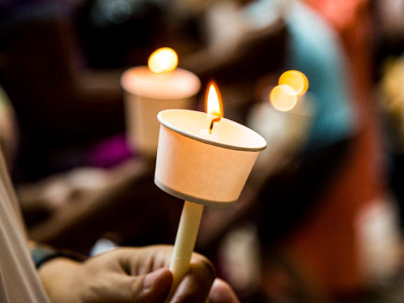 hands holding candle hands holding candle