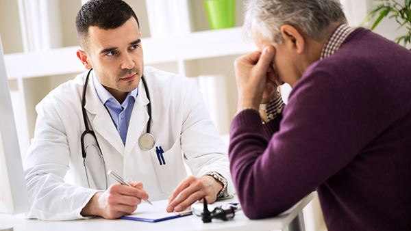 worried  older man talking to doctor worried  older man talking to doctor